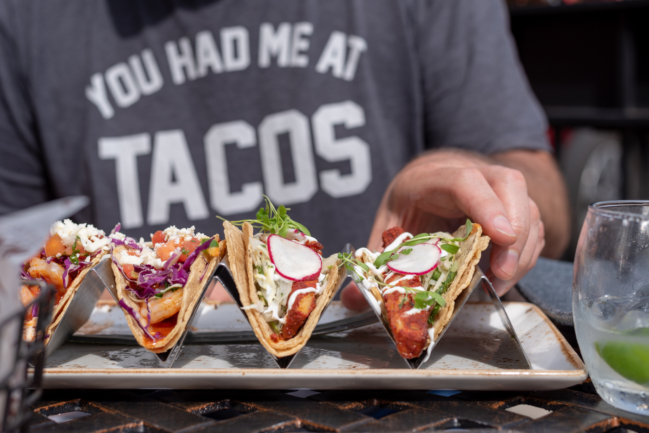 man eating tacos